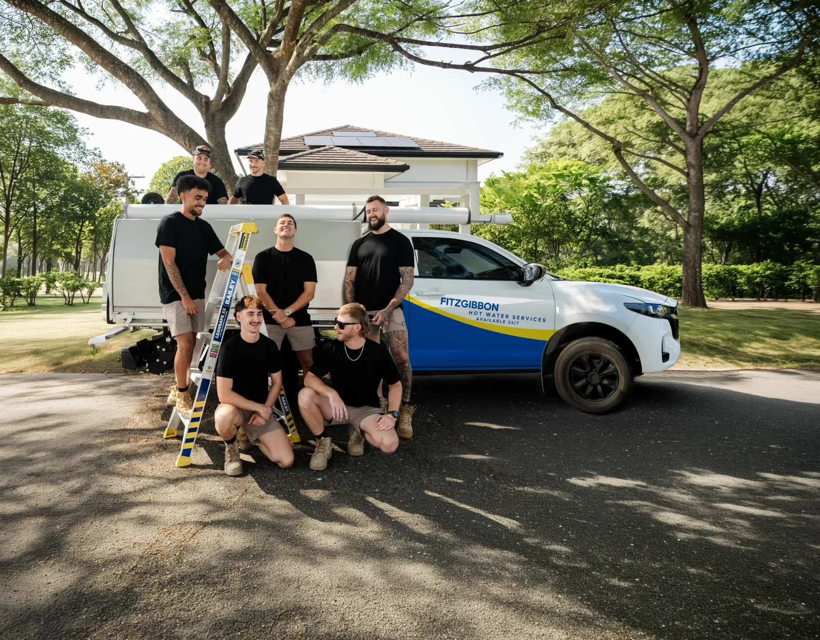 Fitzgibbon Hot Water Services team and ute